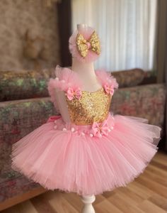 Introducing our Exquisite Pink & Gold Tutu Dress for Kids and Babies - A Magical Fairy Dress Delight! Prepare for enchantment with our meticulously crafted Pink & Gold Tutu Dress. Perfect for 1st-year birthdays, Halloween, festivals, special occasions, adorable toddler girl costumes, and as a stunning first birthday dress, this creation is a true showstopper. 👑 Unmatched Comfort: Soft Tutu on the outside, cotton lining on the inside. No itching or irritation, just pure comfort for your little fairy. 🌟 Tailored Perfection: Fully customizable for a perfect fit. Adjustable straps and elastic waist ensure your baby girl feels comfortable and looks amazing. 💖 Superior Craftsmanship: Sewn with love, this fairy dress stands out from the crowd. ✨ Unveiling the Extraordinary: 1️⃣ Premium Quality Pink Princess Dress For Christmas Party, Christmas Princess Dress In Pink, Pink Tulle Tutu Dress For Christmas, Princess Style Tutu Dress For Party Season, Pink Tulle Tutu Dress For Festive Occasions, Festive Pink Tulle Tutu Dress, Festive Princess Tulle Dress, Festive Pink Ruffled Tutu Dress, Christmas Birthday Princess Dress