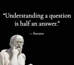 a statue with a quote on it that says, understanding a question is half an answer