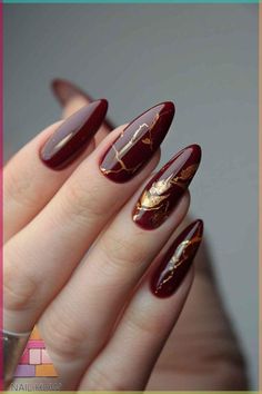 Elegant fall nail designs featuring deep burgundy with gold accents. Perfect for those who love classy and sophisticated acrylic nails for fall. Visit nailhow.com for more fall nail inspiration. Don't forget to save this pin for your next nail appointment! Red Nails Marble Design, Wedding Nails Red And Gold, Cabernet Wedding Nails, Crimson Nails Designs, Maroon Autumn Nails, Burgundy Nails Gold Accent, Gel Nail Designs Red Classy, Crimson And Gold Nails, Wine Red Nails Designs Fall