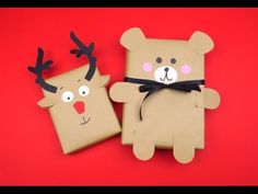 two brown paper bags with reindeer faces on them