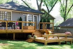 a wooden deck in front of a house