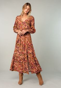 An ultra-flowy long sleeve bohemian maxi dress in a vintage-inspired clay red floral print. Designed in Los Angeles, California. Shop beautiful bohemian dresses here! Brown Long Sleeve Maxi Dress With Boho Print, Long Sleeve Brown Maxi Dress With Boho Print, Brown V-neck Maxi Dress With Floral Print, Brown Floral Print V-neck Maxi Dress, Long Fall Dresses, Long Flowy Skirt, Bohemian Dresses, Maxi Dresses Fall, Voluminous Sleeves