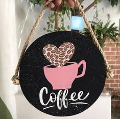 a sign that says coffee with a heart on it