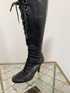 Classic tall black leather lace up boots. Please see further details below. Label - Nine West Leather upper with man made heel and sole. Size 7 US  4" heel 18.5" tall  Widest part of exterior sole is approximately 2.75"  Interior sole length 9.3" approximately 14" wide calf with additional elastic gusset Side zipper closure.  Decent vintage condition. There is a tear to the interior lining near the heel in one boot, minor signs of wear to interior lining in other boot as well as minor scuff mark Boots Cottagecore, Boots Steampunk, Lace Up Riding Boots, Boots Y2k, Go Go Boots, Victorian Boots, Steampunk Victorian, Green Boots, Tall Fashion