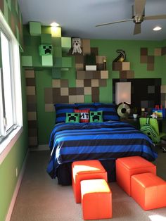 a bedroom decorated in green, brown and blue with a minecraft themed headboard