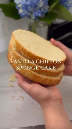 a person holding a sandwich in their hand with the words vanilla chipon sponge cake on it