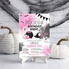 a pink and black halloween birthday party with pumpkins