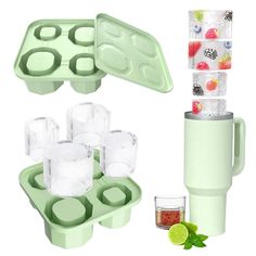 the ice tray is filled with cups and fruit in it, next to an ice cube maker