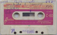 an old pink and white cassette with writing on it