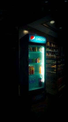 a pepsi vending machine in the dark