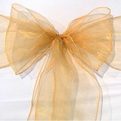 a large yellow bow on a white background