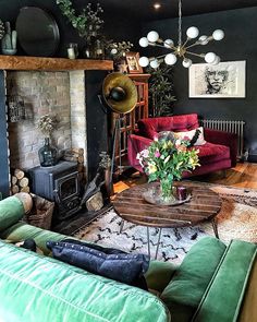 a living room filled with furniture and a fire place