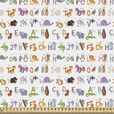 a white fabric with letters and animals printed on the back in multicolored colors