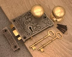 an assortment of antique brass door knobs and keys on a wood flooring surface