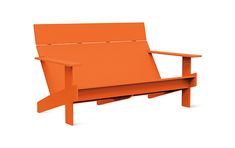 an orange couch sitting on top of a white floor