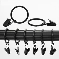 an image of a set of hooks attached to a rail with wires and clips on it