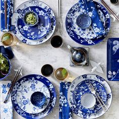 an image of a table setting with blue and white plates