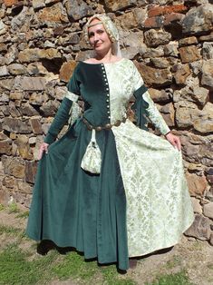 Medieval Europe fashion of 14th century. Dress made from brocade Fabric and cotton Velvet Fabric. The front part is button fastening. Buttons are hand made from Fabric. Buttonhole embroidered by hand. Hat is decorated with pearls and Veil. This dress will be made to measure. Please send me your measurements following this guide: A - max. chest circumference B - min. waist circumference C - max. circumference of hips D - length of your back - from your 7th cervical (neck) vertebra to the waist E Medieval Long Sleeve Dress For Fancy Dress, Elven Dresses For Medieval Festivals, Regency Style Long Sleeve Medieval Dress For Festivals, Vintage Medieval Dress For Medieval Festivals, Historical Victorian Dress For Larp, Vintage Medieval Dress For Larp With Historical Design, Victorian Dress With Historical Design For Medieval Festivals, Medieval Style Victorian Long Sleeve Dress, Elven Style Medieval Dress For Medieval Festivals