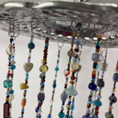 several beads hanging from a ceiling in a room