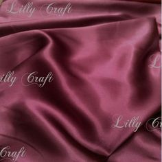 an image of a pink satin fabric with the names lilly craft and lily craft on it