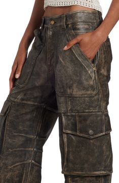 Faded napa leather elevates the workwear-inspired aesthetic of baggy cargo pants that easily channel the label's laid-back luxury. Zip fly with button closure Front slant pockets; drop-in pockets; back patch pockets; cargo flap-patch pockets Lined Leather Professional leather clean Made in Italy Designer Clothing Baggy Leather Pants, 90s Style Icons, Vintage Cargo Pants, Leather Cargo Pants, Clothes Wishlist, Baggy Cargo Pants, Inspired Aesthetic, 2024 Style, Queer Fashion