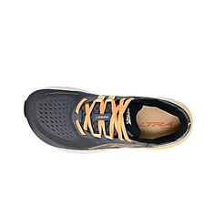 an orange and black shoe on a white background