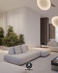 a living room with white couches and round lights