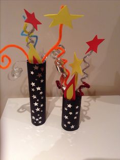 two vases with stars and streamers in them