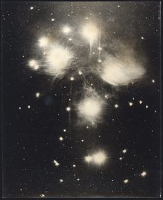 an image of stars in the sky with some black and white images on it's side