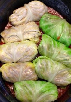 cabbage rolls in a slow cooker filled with sauce