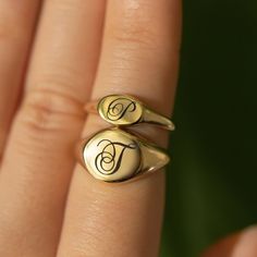 An elegant Script Initial engraved onto our bold Signet Ring. Good weight with a smooth comfort fit polish. Thick layer of 14K Gold over Sterling Silver Hypoallergenic, lead and nickel free Diameter 10mm Band Thickness 2mm #R010-G Oval Signet Ring, Script Initial, Medium Layered Hair, Engraved Ring, Gold Signet Ring, Engraved Jewelry, Engraved Rings, Signet Ring, Ring Necklace