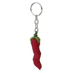 a red key chain with a strawberry on it