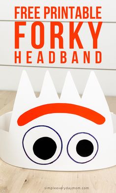 a paper crown with the words free printable forky headband on it and eyes