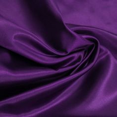 Charmeuse Satin Fabric by the yard, bolt, or wholesale. This Eggplant charmeuse silk fabric has a very soft hand and a silky feel. It is light in weight and has beautiful drape that makes it perfect for dresses, special occasion apparels, and gowns. It is also often used for intimate apparels, robes, and pajamas. Size: 1 Yard.  Color: Purple. Chic Peas, Wedding Apparel, Crafts Decor, Purple Satin, Fabric Bolts, Beautiful Drapes, Tulle Fabric, Jersey Knit Fabric, Textured Knit