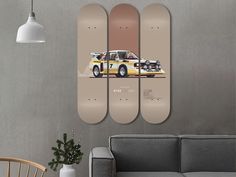 three skateboards mounted to the wall in a living room with a couch and table