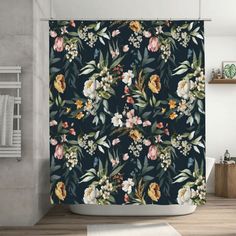 the shower curtain is decorated with flowers and leaves