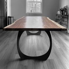 a wooden table sitting in the middle of a room