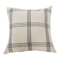 a white and black plaid pillow on a white background