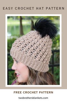 a woman wearing a crochet hat with a black pom - pom