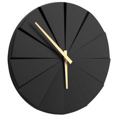 a black clock with gold hands on a white background