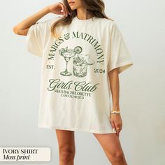 a woman wearing a white t - shirt that says marc & matrony girls club