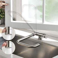 a hand is holding the faucet in front of a kitchen sink and window