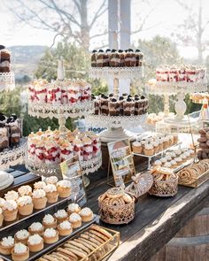 an assortment of desserts and pastries displayed on a table