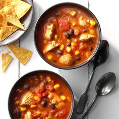 two bowls of mexican chicken soup with tortilla chips