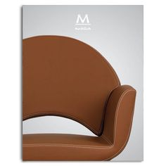 a brown leather chair with the letter m on it's back and armrests