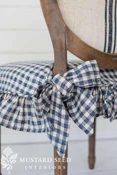 the back of a chair with a blue and white checkered bow tie on it