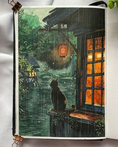 an open book with a painting of a cat sitting on a window sill in the rain