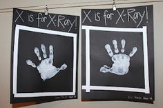 two handprints are hung on the wall