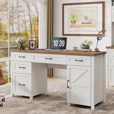 a white desk sitting in front of a window next to a chair and table with a clock on it