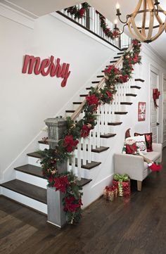 christmas decorations on the banisters and stairs in a home